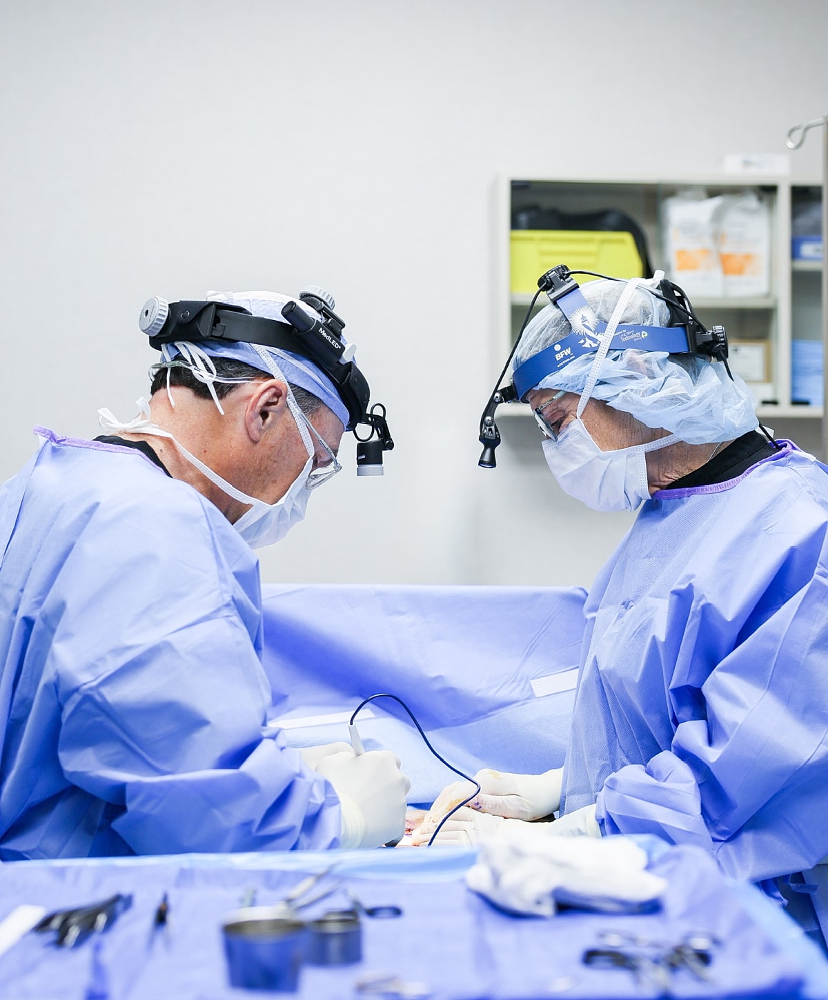 Surgeons performing a procedure in operating room.