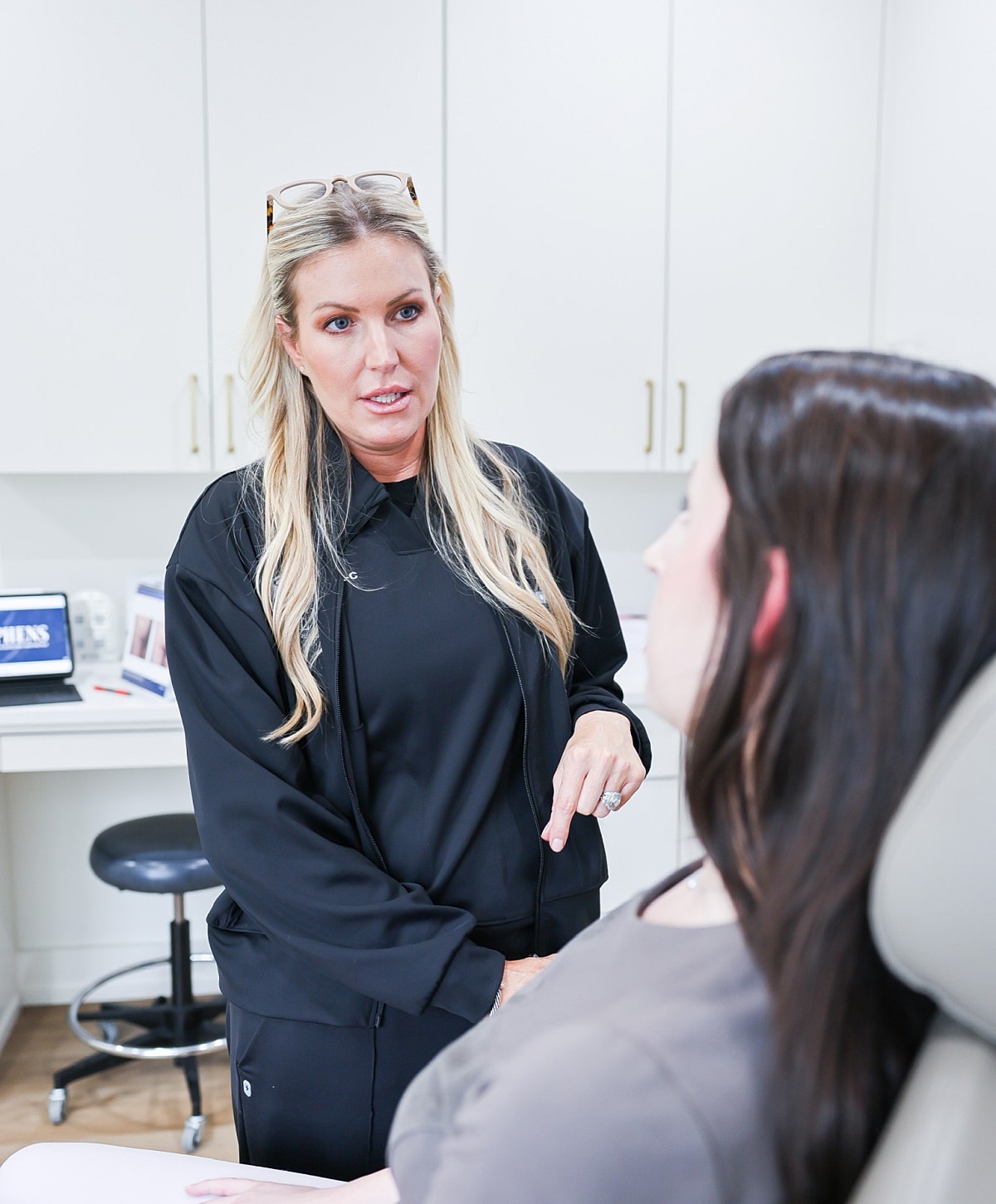Consultation between practitioner and client in clinic.