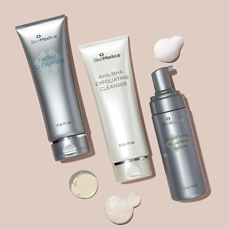 SkinMedica facial cleansers on a neutral background