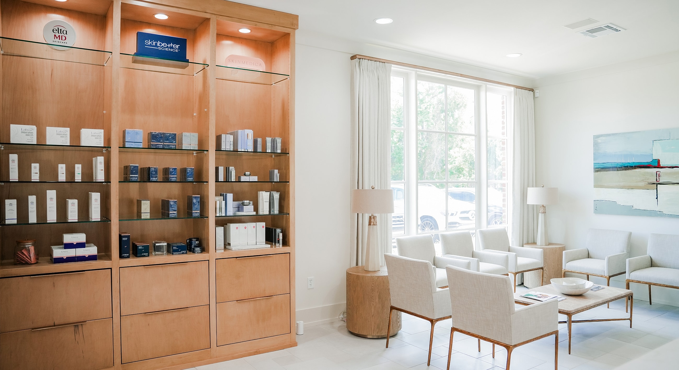 Spa interior with skincare displays and seating.